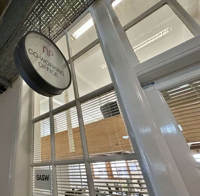 a sign outside a charity coworking space in edinburgh leith