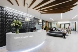 OregaGracechurchStreet ReceptionDesk WithPeople 300x200